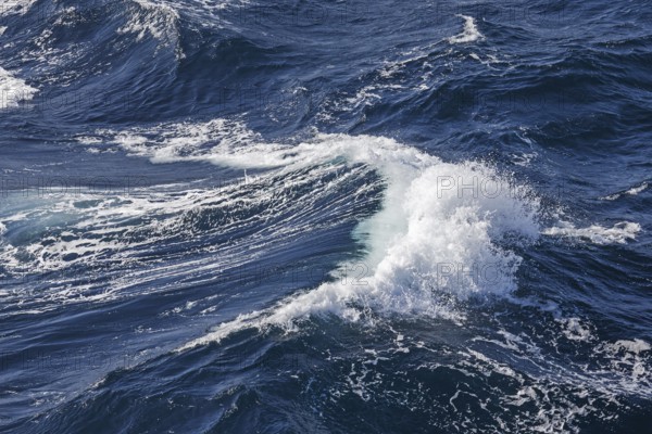Wave with foam crest on the atlantic ocean during stormy wind and rough sea Rough sea with breaking
