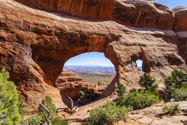 Double O Arch. The beauty of Arches Park in USA. Picturesque red-brown sandstone cliffs form a