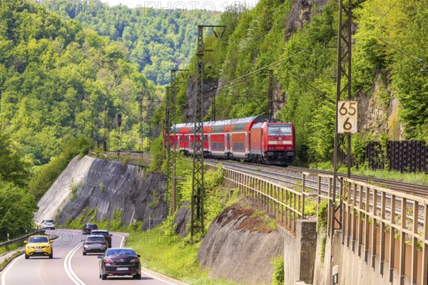 Regional express RE5 en route on the winding railway line of the Geislinger Steige. Landscape along