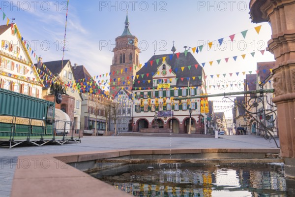 Lively town view with pennants and a bell tower in historical surroundings, Fasnet, Weil der Stadt,
