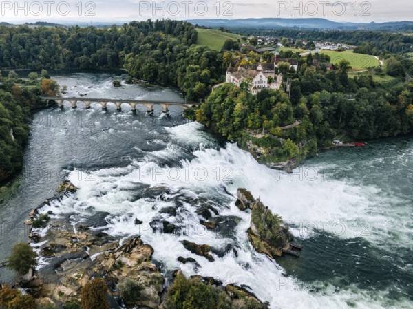 Aerial view of the Rhine Falls with railway viaduct and Laufen Castle in autumn, Neuhausen, Canton