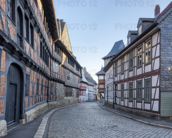 Alley with half-timbered houses and cobblestones in the historic old town, on the left the Siemens