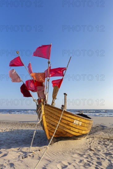 Traditional wooden fishing boat on the beach along the Baltic Sea at Stubbenfelde, Loddin on the