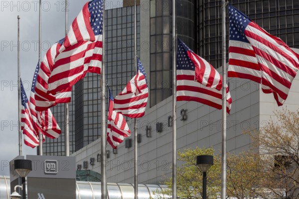 Detroit, Michigan - American flags flying in front of the General Motors headquarters in the