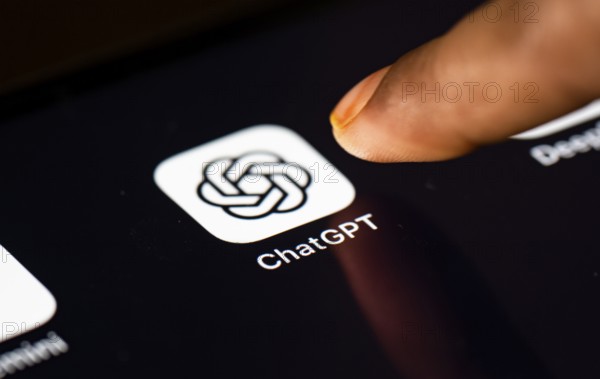 In this photo Illustration a person taps ChatGPT app icon on a tablet device on 24 May 2025 in New