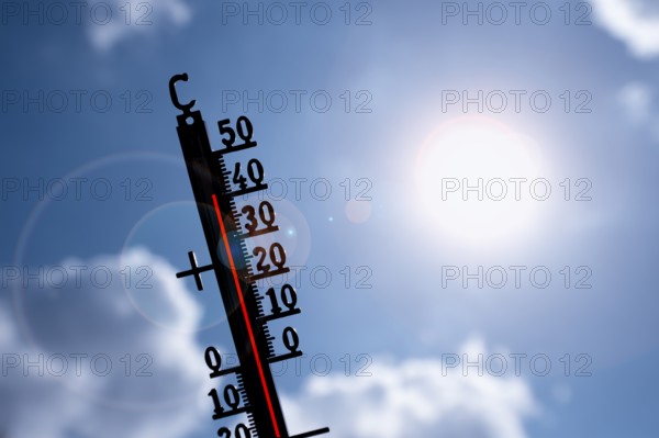 Symbolic image heat wave, thermometer in the sun, summer, climate change, temperature, record heat,