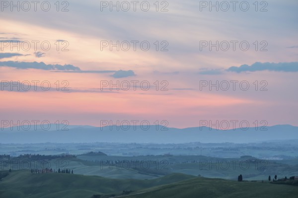 Hilly landscape at sunrise, morning light, Tuscany, Siena province, Italy