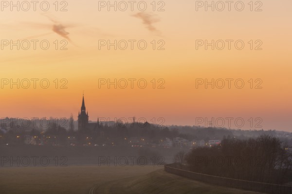 Sunset with the Briesnitz church, large amounts of Sahara dust colour the evening sky particularly