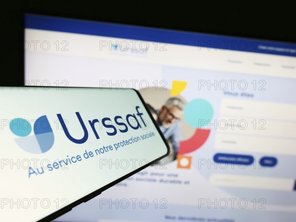 Stuttgart, Germany, 07-12-2023: Smartphone with logo of French social security organization URSSAF