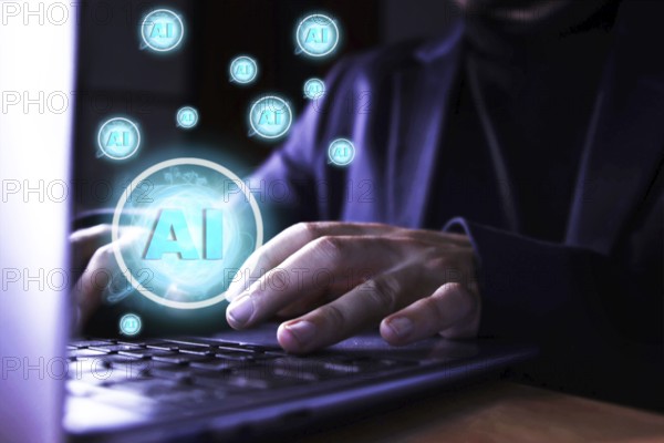 Close up of a man using a computer with artificial intelligence icons. use of artificial