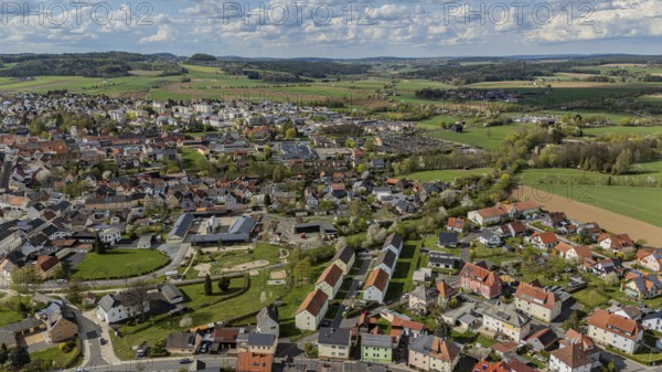 Panorama of a town and surrounding green landscape under a cloudy sky, Mitterteich, Upper