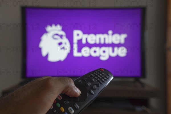May 14, 2024, Brazil. In this photo illustration, a hand holding a TV remote control in front of