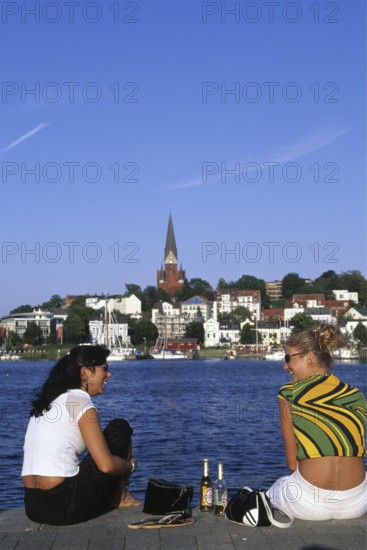 Two girls at the harbour of Flensburg, Schleswig-Holstein, Germany