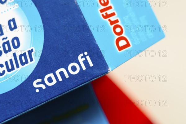 In this photo illustration, the Sanofi logo is seen on the box of the medicine Dorflex, used as an