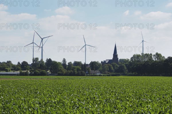 Wind turbines for power generation on the edge of the Garzweiler open-cast lignite mine, with a