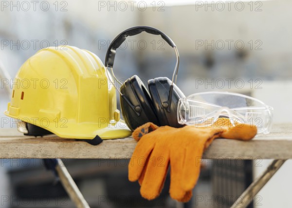 Photo Front view of protective glasses with hard hat and headphones. Resolution and high quality