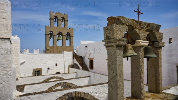 Historic architecture with bell tower under a blue sky, St John's Monastery, Ancient columned