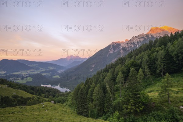 Magical sunset with alpenglow at the Halsalm above Hintersee with views of Hoher Göll and