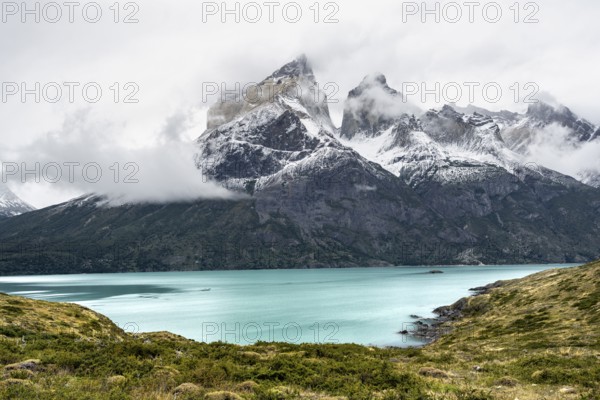 Blue lake Lago Nordenskjöld, Cuernos del Paine mountain range in autumn, Torres del Paine National
