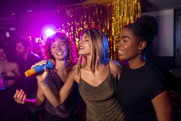 Three young women enjoy a lively karaoke night, singing into a microphone with colorful lights and