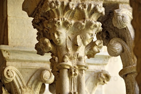 Slender Gothic columns with filigree capitals in the cloister, Gothic basilica of the Cistercian