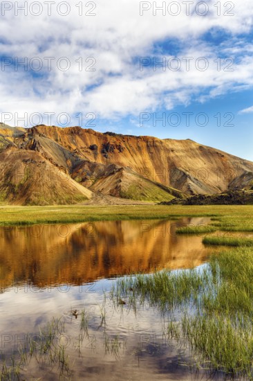 Volcanic landscape, colourful rhyolite mountains, water, Landmannalaugar, remote hiking area in