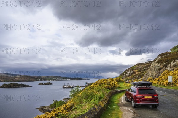 Off road 4x4 car with roof tent over Skye Bridge over Loch Alsh, Kyle of Lochalsh, Isle of Skye,