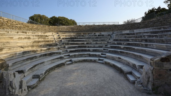 Historic amphitheatre with semi-circular stone steps and intense atmosphere, Ancient Theatre,