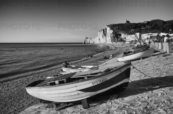 Rowing boat, boats lying on the beach, pebble beach, rock arch Falaise or Porte d'Amont, church