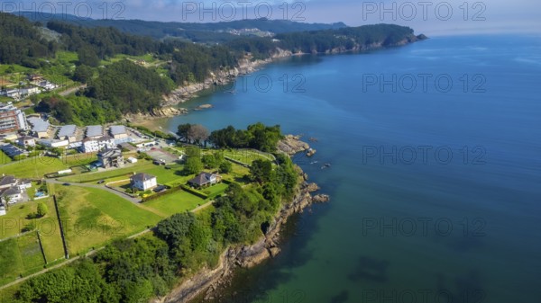 Breathtaking aerial view of covas beach meeting the cantabrian sea, showcasing the stunning