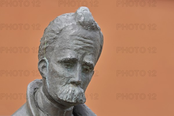 Monument to philosopher Friedrich Nietzsche, bronze sculpture, modern art, man with beard, head,