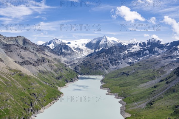 Blue mountain lake in a mountain landscape with glaciers, Lac des Dix reservoir and Mont Blanc de