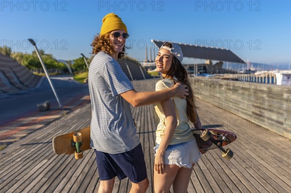 Smiling young adults skateboarding on a sunny boardwalk, capturing the essence of carefree summer