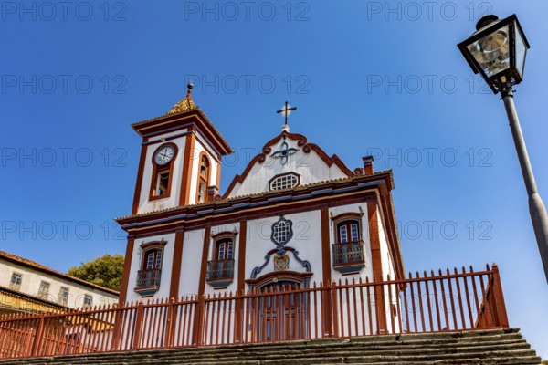 Facade of a colorful historic church in Baroque style in the old town of Diamantina in Minas