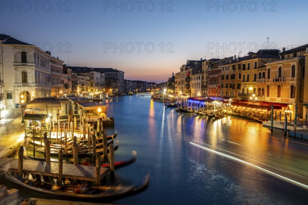 View of the Grand Canal at the blue hour, picturesque evening mood with illuminated palazzos on the