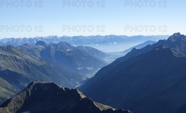 View of the Stubai Valley, mountain silhouettes, from the summit of the Wilder Freiger, Stubai