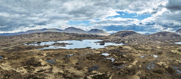 Panorama of Rannoch Moor from a drone over Loch Ba and Loch of the Armpit, A82 Highland Way, Argyll