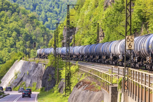 Goods train travelling on the winding Geislinger Steige railway line. Landscape along the railway