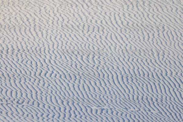 Wind creates wave patterns in the sand dunes at White Sands National Park in Alamogordo, New