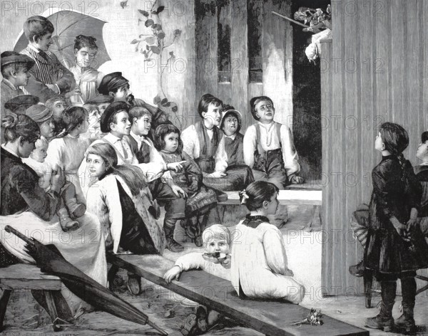 The children's party, many children watch a puppet show, Punch and Judy in the village, around