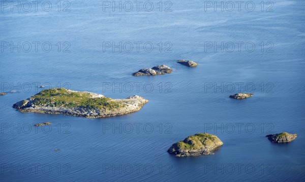 Small rocky islands in the sea, archipelago islands, near Henningsvær, Vågan, Lofoten, Nordland,