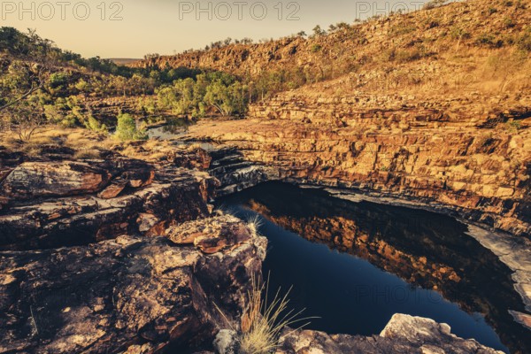 Bell Gorge waterfall, a body of water in north-west Australia in the Kimberley. Sunrise in the