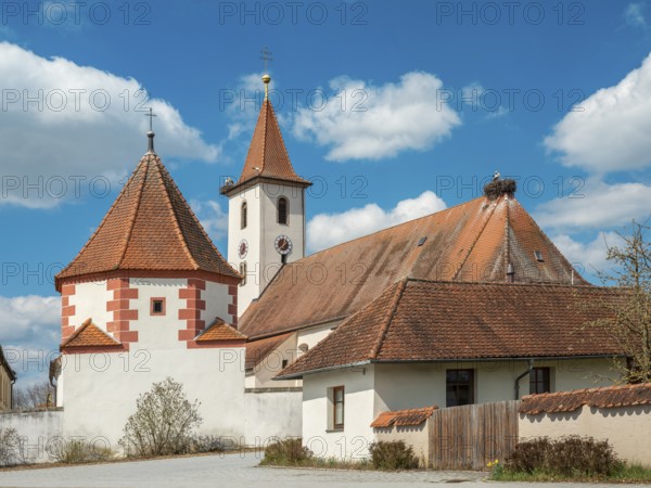 Church of the Visitation of the Virgin Mary in the village of Rauenzell in spring, storks and stork