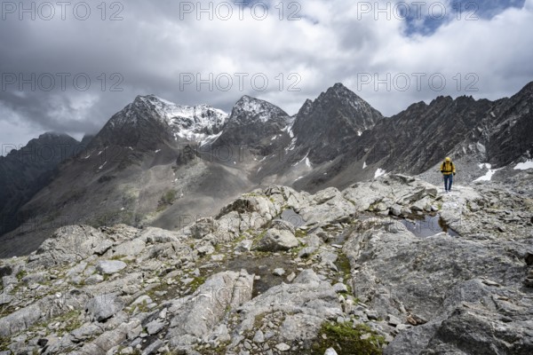 Mountaineer, Small mountain lakes in rocky mountain landscape, Niedere Gradenscharte, summit of