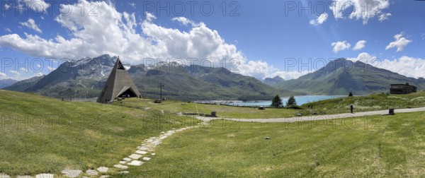 Panoramic view from plateau above Lanslebourg-Mont-Cenis to reservoir Lac du Mont Cenis left Museum