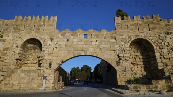 Arsenal Tor, Rhodes city wall, Medieval stone gate with symmetrical arches over the street, harbour