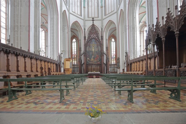Chancel with paintings and choir stalls, Gothic UNESCO Cathedral of St Mary and St John, interior