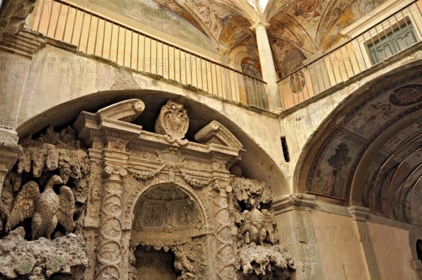 Ornamental fountain from the Renaissance, fountain with moss and artificial dripstone from the