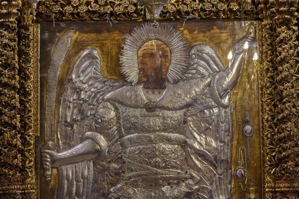 Archangel Michael, detailed icon of an angel with a sword, decorated with golden elements and a