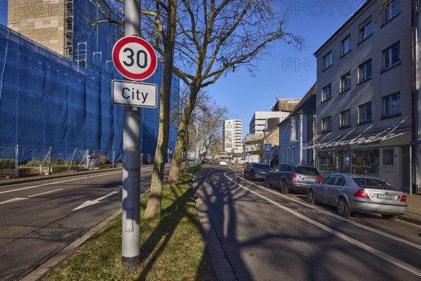 Tempo 30 sign, additional sign City, traffic sign, general development, trees, parking lane with